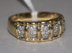 A 14ct gold and diamond gentleman's ring, with five panels of four small diamonds in claw settings