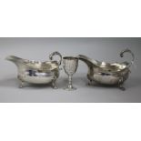 A pair of Edwardian silver sauce boats and a small trophy cup, (one sauceboat a.f.).