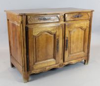 An 18th century French provincial walnut side cabinet, fitted two drawers and two panelled doors,