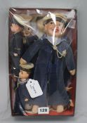 A collection of seven soft-bodied souvenir sailor dolls and two small celluloid examples, the soft-