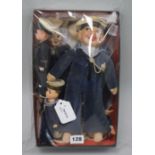 A collection of seven soft-bodied souvenir sailor dolls and two small celluloid examples, the soft-