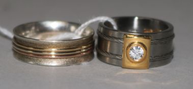 A French 'Acier et Or 750' (steel and 18ct gold) dress ring set cubic zirconia and a similar ring