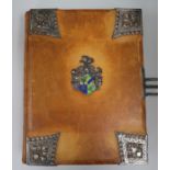 A German leather bound and metal mounted with crest 1912 photo album