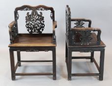 A pair of late 19th century Chinese hongmu armchairs, the splats carved and pierced with ho-ho birds