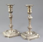 A pair of 1930's 18th century style silver candlesticks, with waisted knopped stems, Hawksworth,