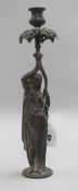 A figural candlestick