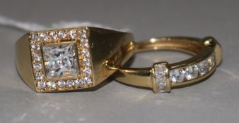 A 14ct gold and cubic zirconia dress ring and a similar smaller ring.