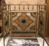 A 3 fold stained glass brass firescreen H.63cm