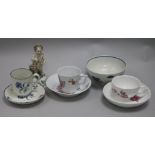 A Derby putto, a Worcester cup and saucer, a Berlin cup and saucer and three other items