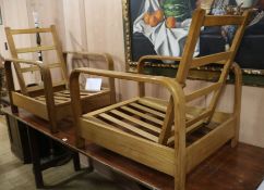 A pair of 1940's natural finish reclining chairs