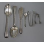 Two Georgian silver spoons and other cutlery.