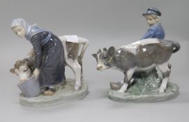 A pair of Royal Copenhagen groups of a milkmaid and a cow herder