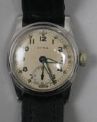 A 1950's boy's? size stainless steel Cyma manual wind wrist watch.