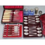 Three cased silver cutlery sets and two scent bottles