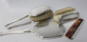 An engine turned silver six piece dressing table set, by William Comyns & Sons Ltd, London, 1950/1