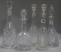 A pair of cut glass decanters and three others