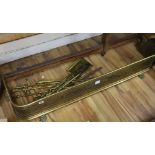 A Regency pierced brass fender, c.1820, W.4ft and brasses