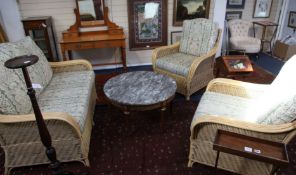 A three piece rattan suite