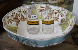 A Staffordshire pottery wash basin and two glass chemists bottles