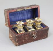 A cased set of three scent bottles