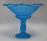 A blue glass pedestal bowl