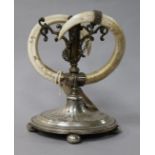 A plated tusk candlestick