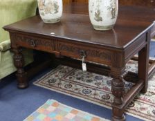 A pair of carved oak side tables, W.137cm