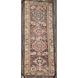 A Shirvan multi coloured runner, c.1900, with four central octagons in a field of animals and flower