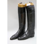 A pair of black ladies riding boots