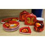 Three Poole Pottery red ground small vases and seven dishes, (10).