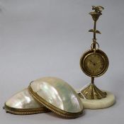 An 18ct gold dress watch contained in a Victorian mother of pearl and gilt metal watch stand