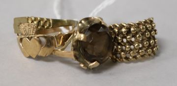 Three 9ct gold rings and a gem-set 9ct gold dress ring.