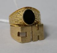 A gentleman's yellow metal and black onyx signet ring (tests as 9ct) and a 'JH' 9ct gold signet