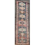 A Shirvan blue ground runner, c.1900, with central stepped and geometric medallion in a field of