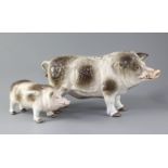 Two Continental porcelain models of standing boars, underglazed blue printed anchor mark and various