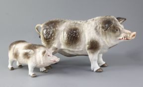 Two Continental porcelain models of standing boars, underglazed blue printed anchor mark and various