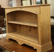 A pine open bookcase W.122cm