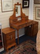 A pair of pine three-drawer bedside chests and a pine dressing table with mirror Dressing table W.