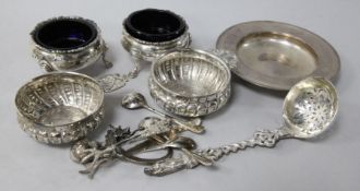 A Victorian cast silver sifter spoon, London, 1873, a small silver alms dish, a pair of Georgian