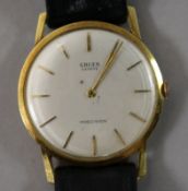 A gentleman's gold Gruen precision manual wind wrist watch.