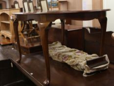 A 1930's mahogany extending dining table, plus two leaves W.152cm