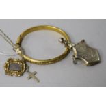 A Victorian mourning brooch, a bangle, scent flask and cross pendant.