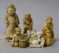 Four Japanese ivory netsuke or okimono and a Chinese ivory figure, 19th century