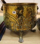 A Victorian brass log bin