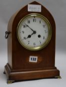 An Edwardian inlaid mahogany lancet top eight day mantel clock