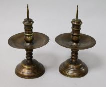 A pair of 17th century bell metal pricket candlesticks