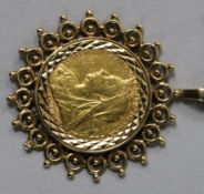 A Victorian 1899 gold sovereign in pierced 9ct gold mount on a 9ct gold suspension chain.