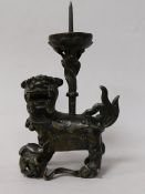 A pair of Chinese bronze 'lion' pricket candlesticks, late Ming dynasty
