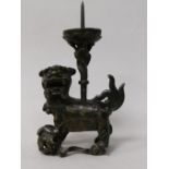 A pair of Chinese bronze 'lion' pricket candlesticks, late Ming dynasty