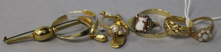 An 18ct gold ring, a 9ct gold and white opal ring, two other rings, two pairs of earrings and a